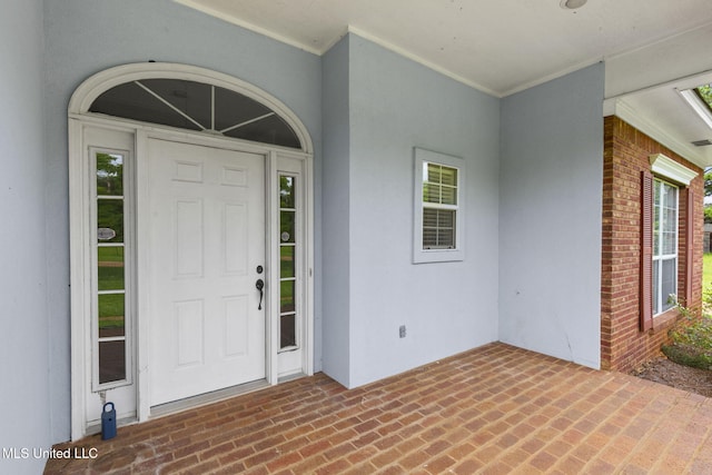380 Green Acres Dr, Canton, MS 39046 - entrance to property featuring brick siding, stucco siding, and a patio area