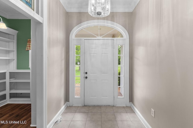 380 Green Acres Dr, Canton, MS 39046 - tiled entryway featuring a chandelier and crown molding