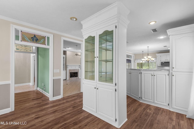 380 Green Acres Dr, Canton, MS 39046 - corridor featuring ornamental molding, a chandelier, dark wood-style floors, and recessed lighting