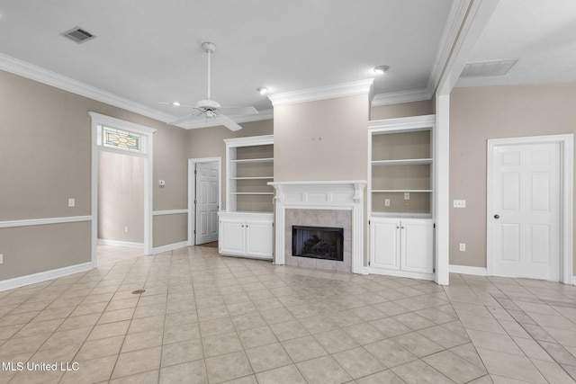 380 Green Acres Dr, Canton, MS 39046 - unfurnished living room with crown molding, a ceiling fan, a tile fireplace, light tile patterned floors, and built in features
