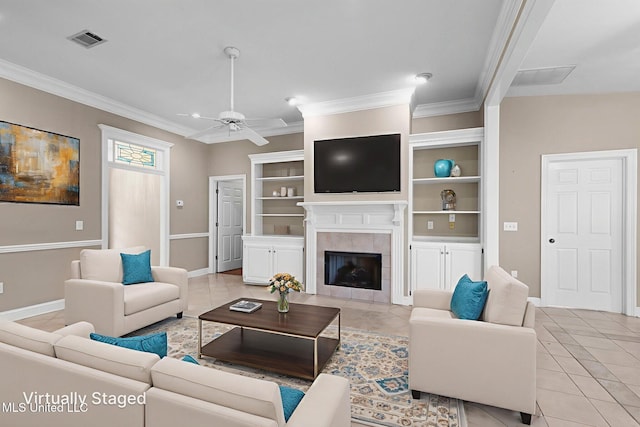 380 Green Acres Dr, Canton, MS 39046 - living room featuring light tile patterned floors, ceiling fan, crown molding, a fireplace, and built in shelves