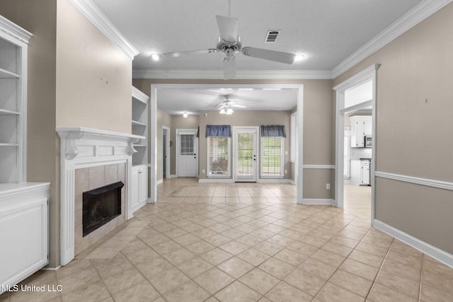 380 Green Acres Dr, Canton, MS 39046 - unfurnished living room featuring ceiling fan, ornamental molding, a tiled fireplace, built in features, and light tile patterned floors