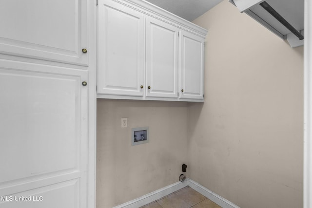 380 Green Acres Dr, Canton, MS 39046 - washroom with cabinet space, hookup for a washing machine, and light tile patterned flooring