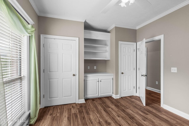 380 Green Acres Dr, Canton, MS 39046 - unfurnished bedroom featuring dark wood-style flooring, ornamental molding, and a ceiling fan