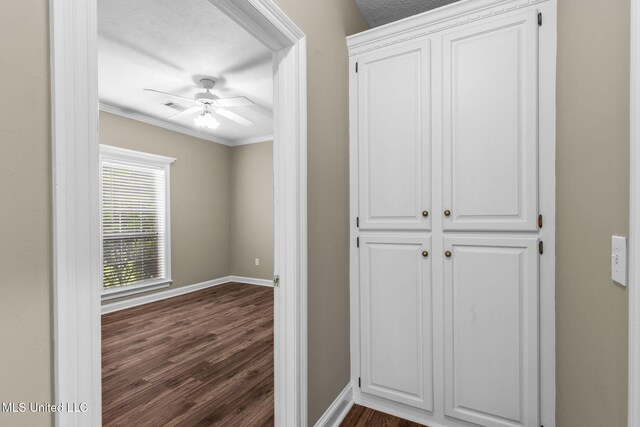 380 Green Acres Dr, Canton, MS 39046 - hallway with dark wood-type flooring, ornamental molding, and a textured ceiling