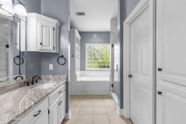 380 Green Acres Dr, Canton, MS 39046 - bathroom featuring vanity, a bath, a stall shower, tile patterned flooring, and recessed lighting