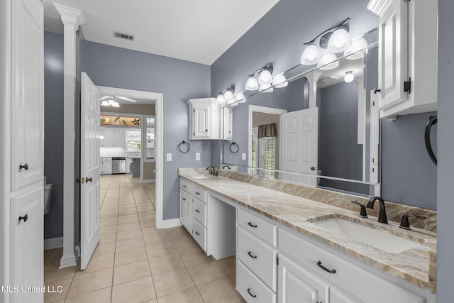 380 Green Acres Dr, Canton, MS 39046 - bathroom with double vanity, tile patterned floors, and decorative columns