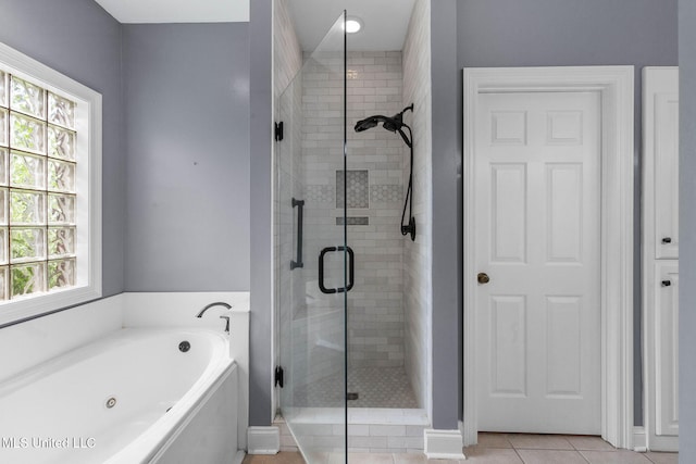 380 Green Acres Dr, Canton, MS 39046 - bathroom with a jetted tub, a stall shower, and tile patterned floors