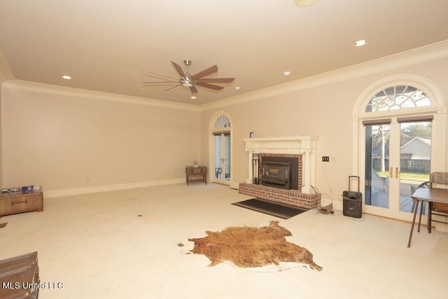 unfurnished living room with carpet, a ceiling fan, ornamental molding, baseboards, and recessed lighting