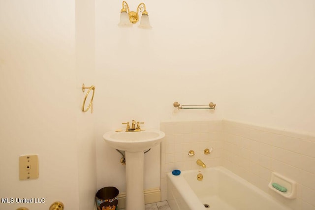 bathroom with a tub to relax in