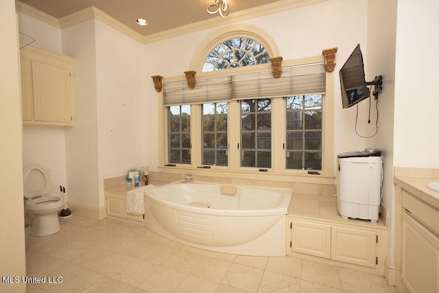 bathroom with vanity, a tub, crown molding, and toilet