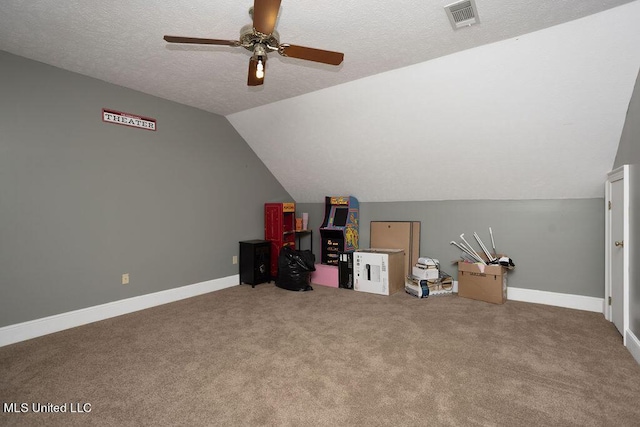 bonus room with ceiling fan, carpet floors, lofted ceiling, baseboards, and a textured ceiling