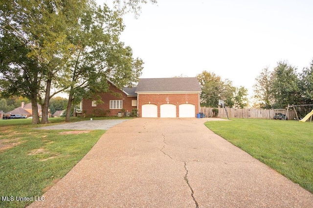 view of front of home with driveway, a garage, brick siding, a playground, and roof with shingles