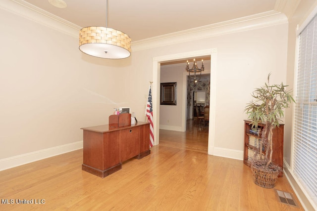 hallway featuring light hardwood / wood-style floors, crown molding, and an inviting chandelier