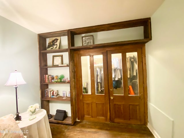 doorway to outside with french doors and dark hardwood / wood-style flooring