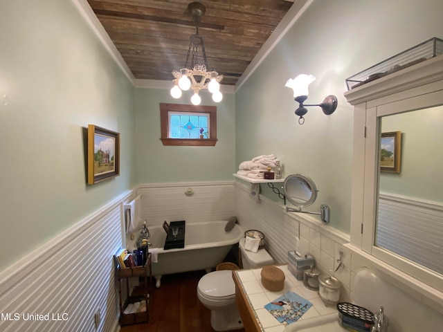 bathroom with toilet, a tub, wooden ceiling, an inviting chandelier, and vanity