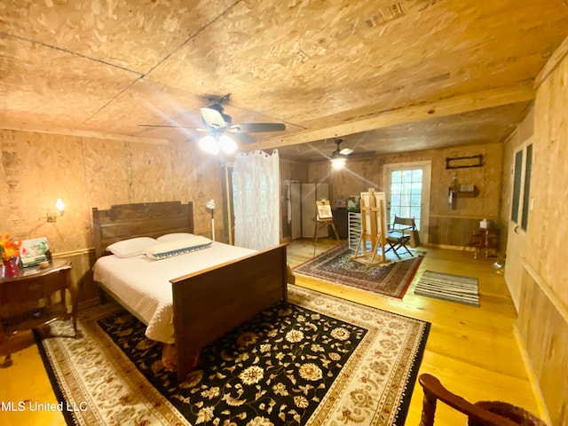 bedroom with hardwood / wood-style flooring