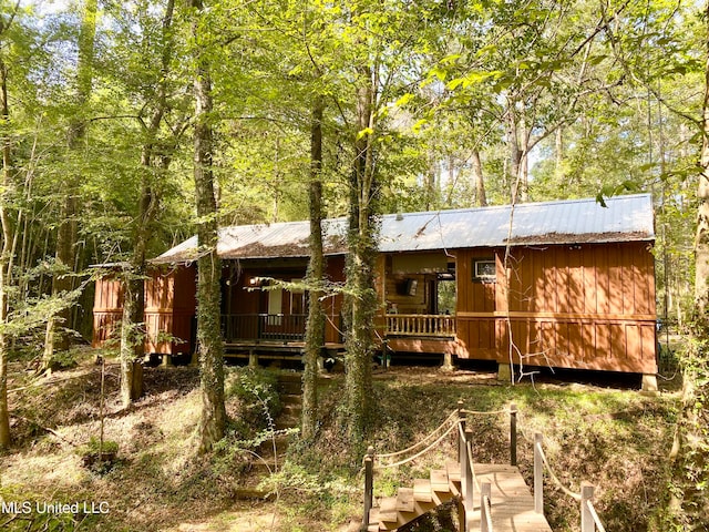 rear view of property with a deck