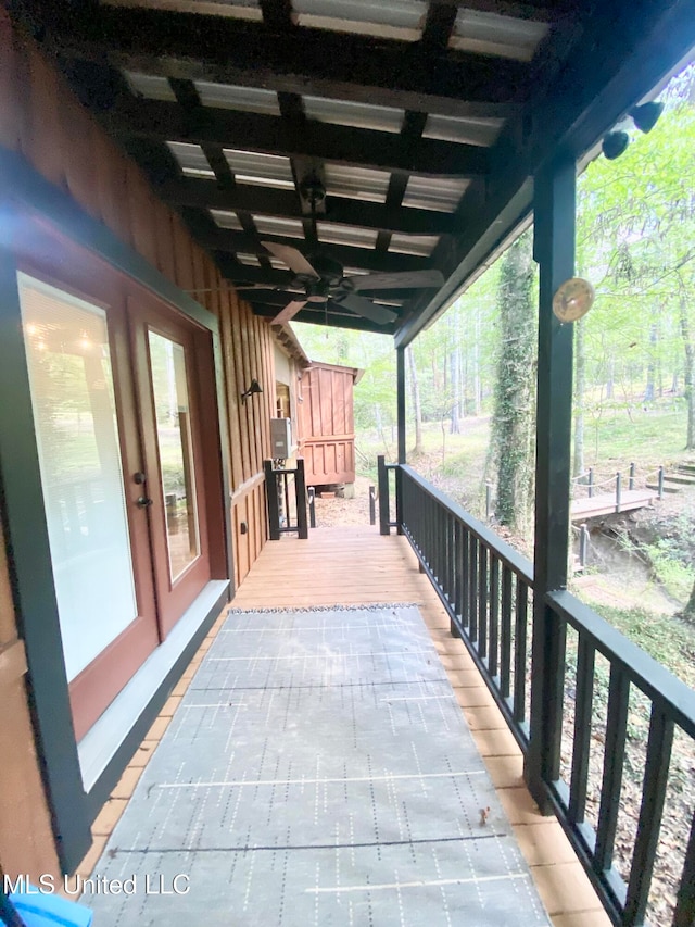 view of patio featuring french doors and ceiling fan