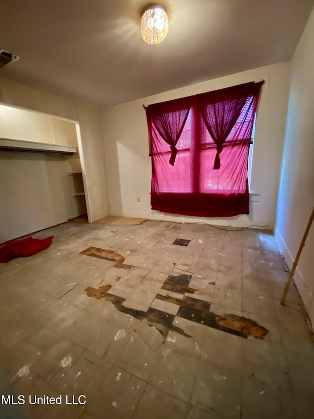 1903 Circle Dr, Picayune, MS 39466 - unfurnished living room with baseboards and visible vents