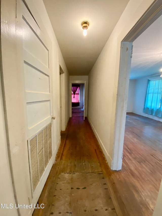 1903 Circle Dr, Picayune, MS 39466 - hall with visible vents, baseboards, and wood finished floors