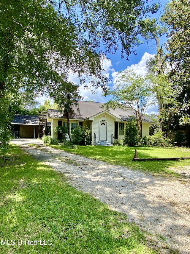 1903 Circle Dr, Picayune, MS 39466 - ranch-style house featuring a shingled roof, dirt driveway, and a front lawn