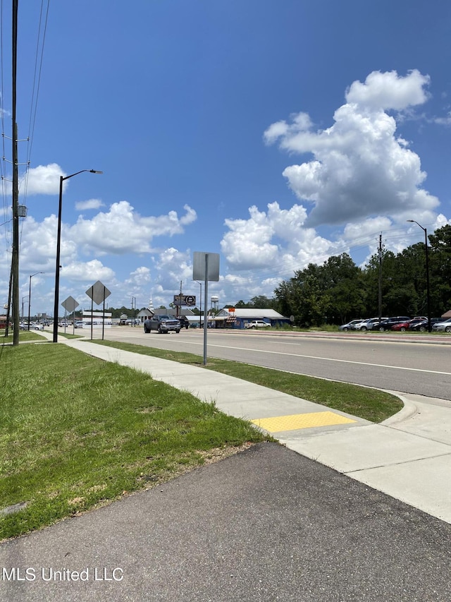 1903 Circle Dr, Picayune, MS 39466 - view of road featuring traffic signs, street lighting, and sidewalks