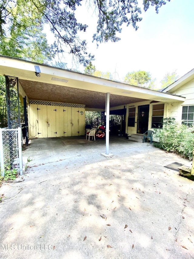 1903 Circle Dr, Picayune, MS 39466 - view of vehicle parking with an attached carport and concrete driveway