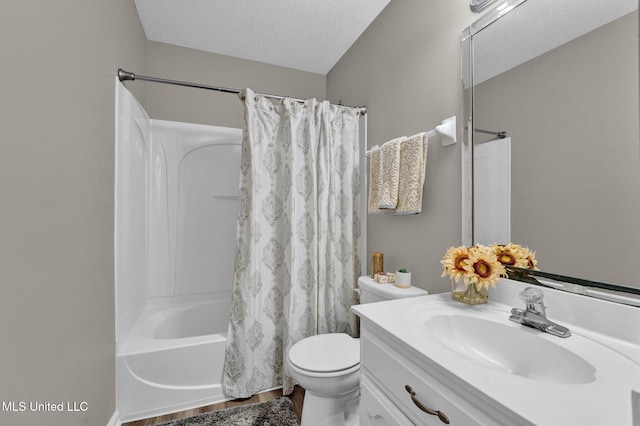 full bathroom with shower / bath combo, a textured ceiling, toilet, vanity, and hardwood / wood-style flooring