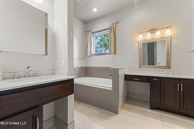 31 Poplar Cir, Gulfport, MS 39507 - bathroom featuring two vanities, a bath, and tile patterned flooring