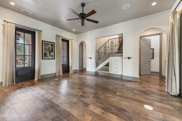 31 Poplar Cir, Gulfport, MS 39507 - unfurnished living room featuring arched walkways, ceiling fan, wood finished floors, stairway, and recessed lighting