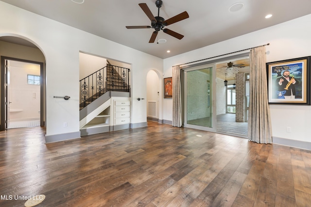 31 Poplar Cir, Gulfport, MS 39507 - unfurnished living room with arched walkways, a ceiling fan, hardwood / wood-style floors, stairway, and recessed lighting