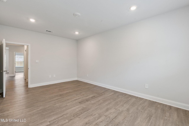 5006 Sand Dollar Dr, Long Beach, MS 39560 - empty room with wood finished floors and recessed lighting