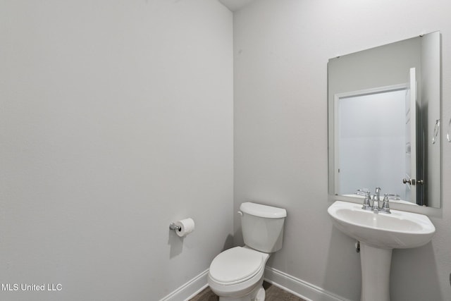 5006 Sand Dollar Dr, Long Beach, MS 39560 - bathroom with toilet and baseboards