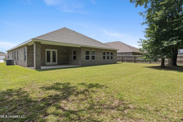 5006 Sand Dollar Dr, Long Beach, MS 39560 - back of property with french doors, brick siding, a patio, and a shingled roof
