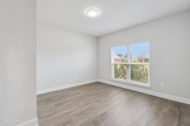 5006 Sand Dollar Dr, Long Beach, MS 39560 - empty room featuring baseboards and wood finished floors