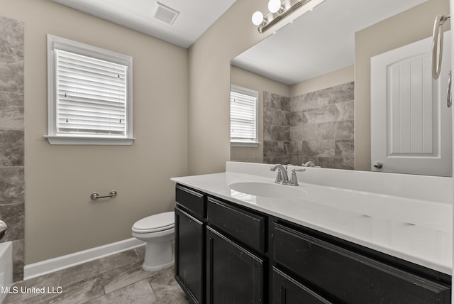 bathroom with vanity and toilet