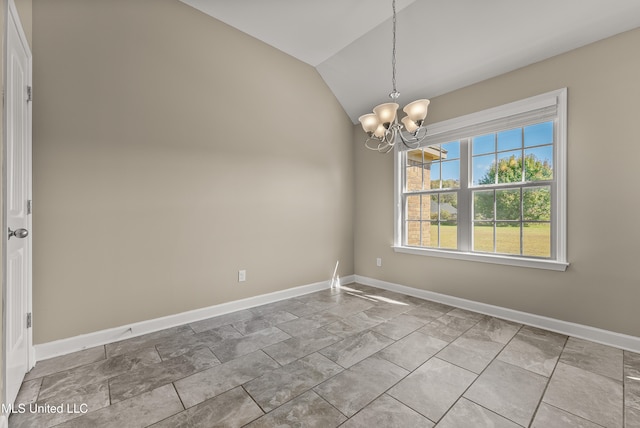 empty room featuring an inviting chandelier and lofted ceiling