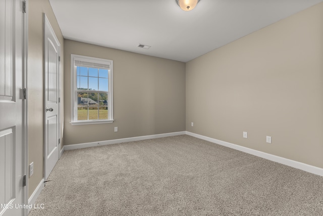 unfurnished room with carpet floors