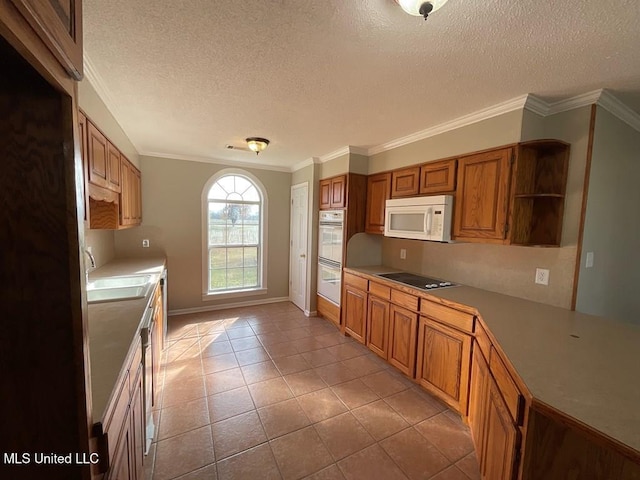 kitchen featuring white appliances, sink, ornamental molding, a textured ceiling, and light tile patterned flooring