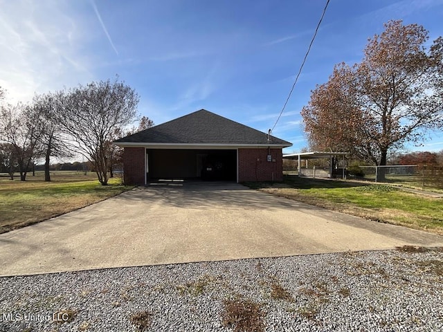 view of home's exterior featuring a garage and a lawn