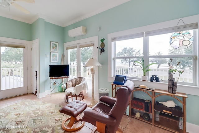 sitting room with ornamental molding, ceiling fan, a wall unit AC, and light tile patterned floors