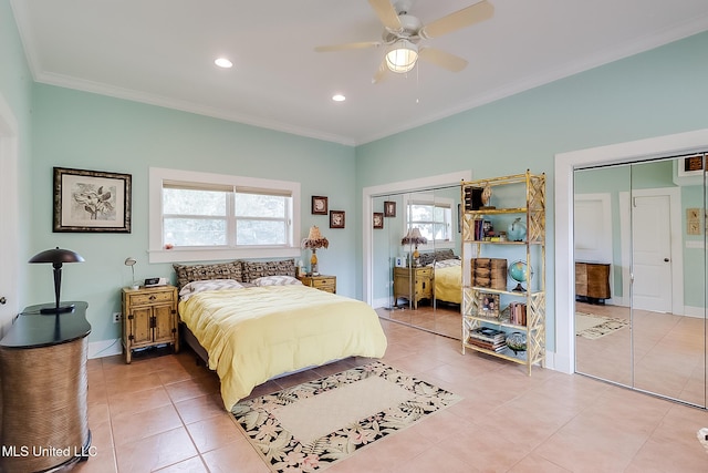 bedroom featuring ceiling fan, light tile patterned flooring, two closets, and crown molding