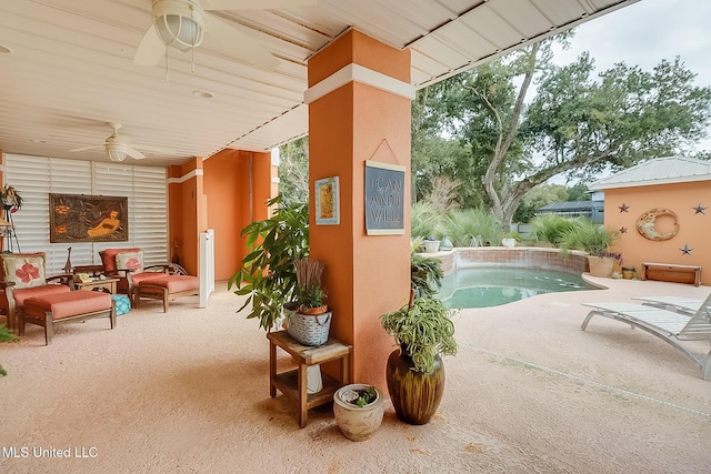 view of swimming pool featuring a patio area and ceiling fan