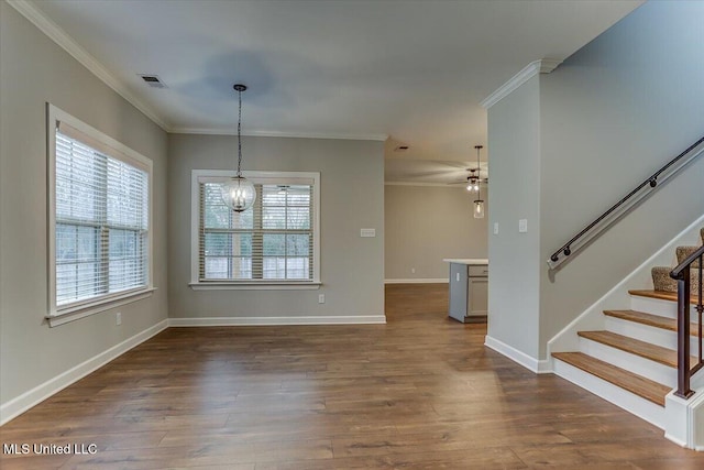 interior space featuring stairs, visible vents, dark wood finished floors, and ornamental molding