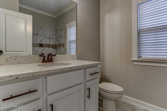 full bathroom with marble finish floor, crown molding, toilet, vanity, and baseboards