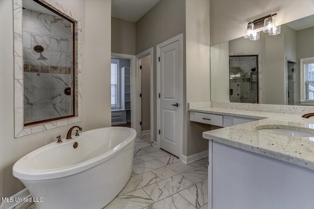 bathroom with a stall shower, baseboards, marble finish floor, a freestanding bath, and vanity