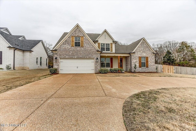 traditional home featuring brick siding, concrete driveway, an attached garage, and fence