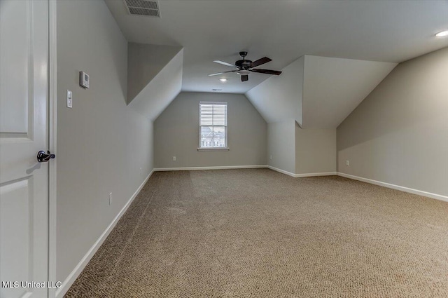 bonus room with vaulted ceiling, carpet flooring, visible vents, and baseboards