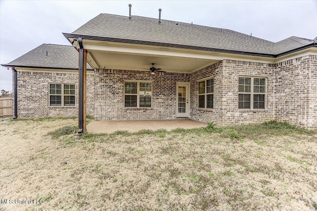 rear view of house with a patio area, brick siding, and ceiling fan